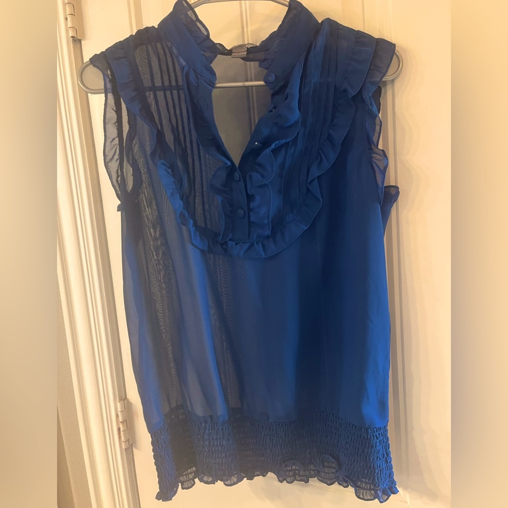 Sheer navy sleeveless blouse.